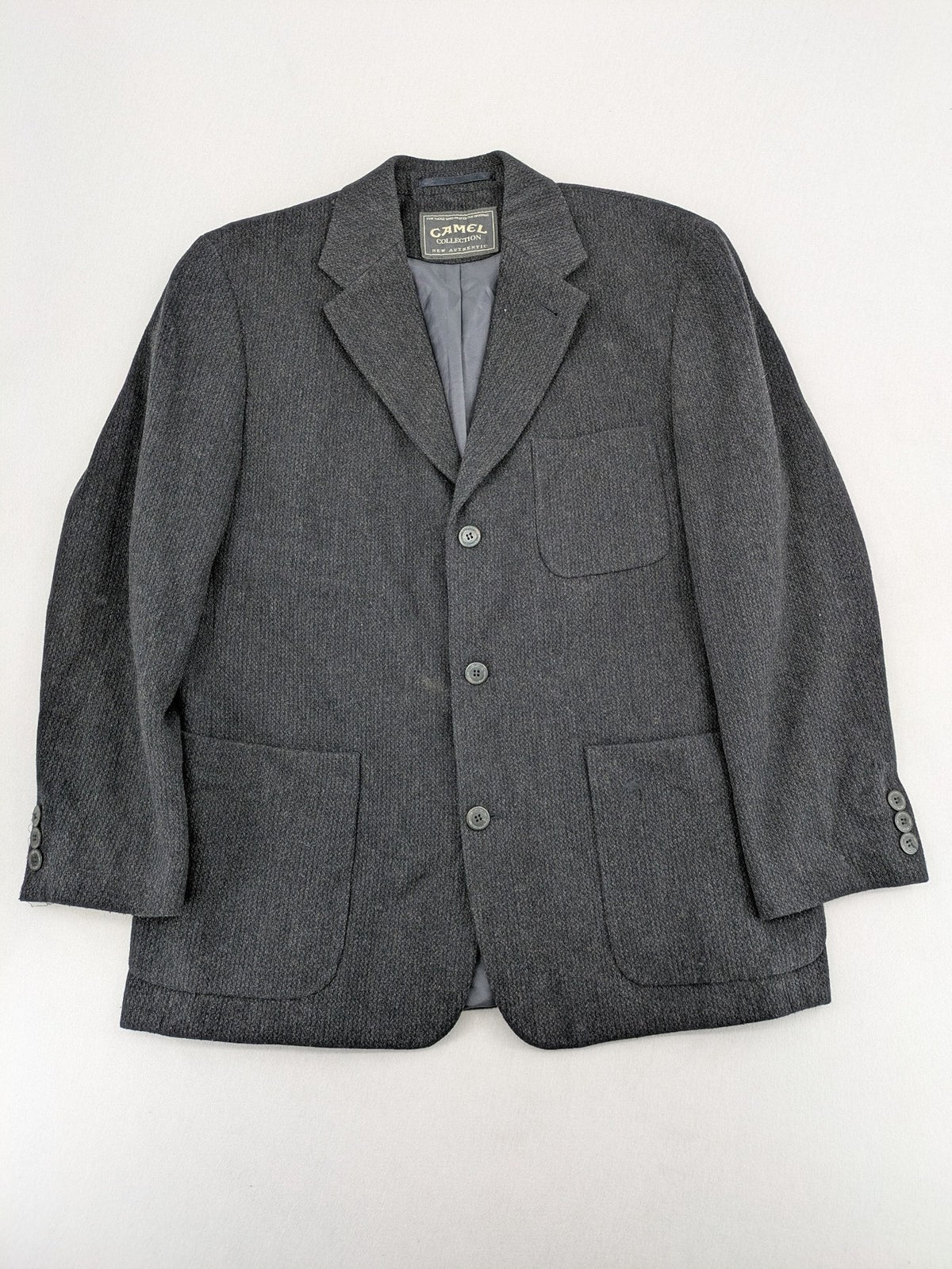 Camel Collection grey blazer three-button front with patch pockets, made from wool blend.