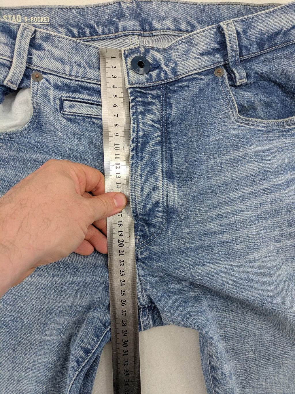 G-Star Raw blue slim fit jeans with 5-pocket design and light wash denim.