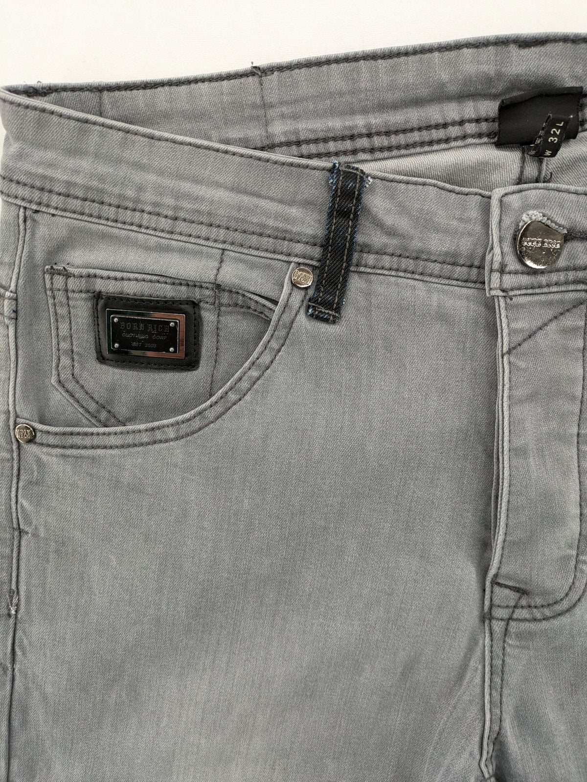Born Rich grey slim fit jeans with logo patch and washed denim look.