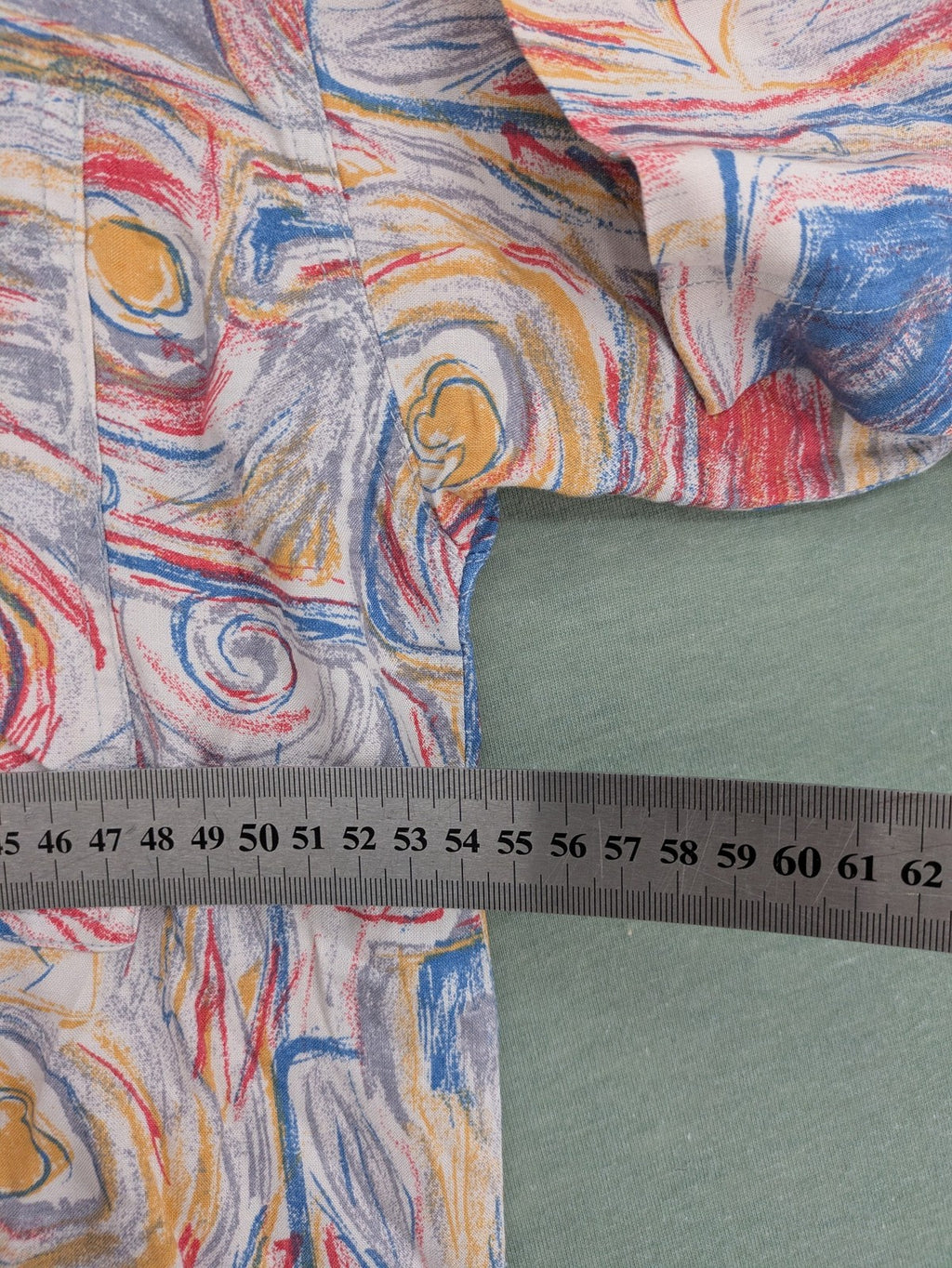 Limit short-sleeve shirt multi-coloured abstract pattern, lightweight viscose, chest pocket detail.