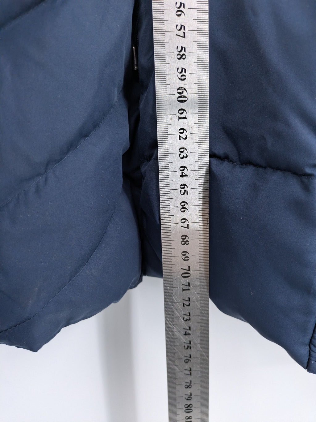 Esprit navy puffer jacket with belt, high collar, ribbed inner lining, and button placket.