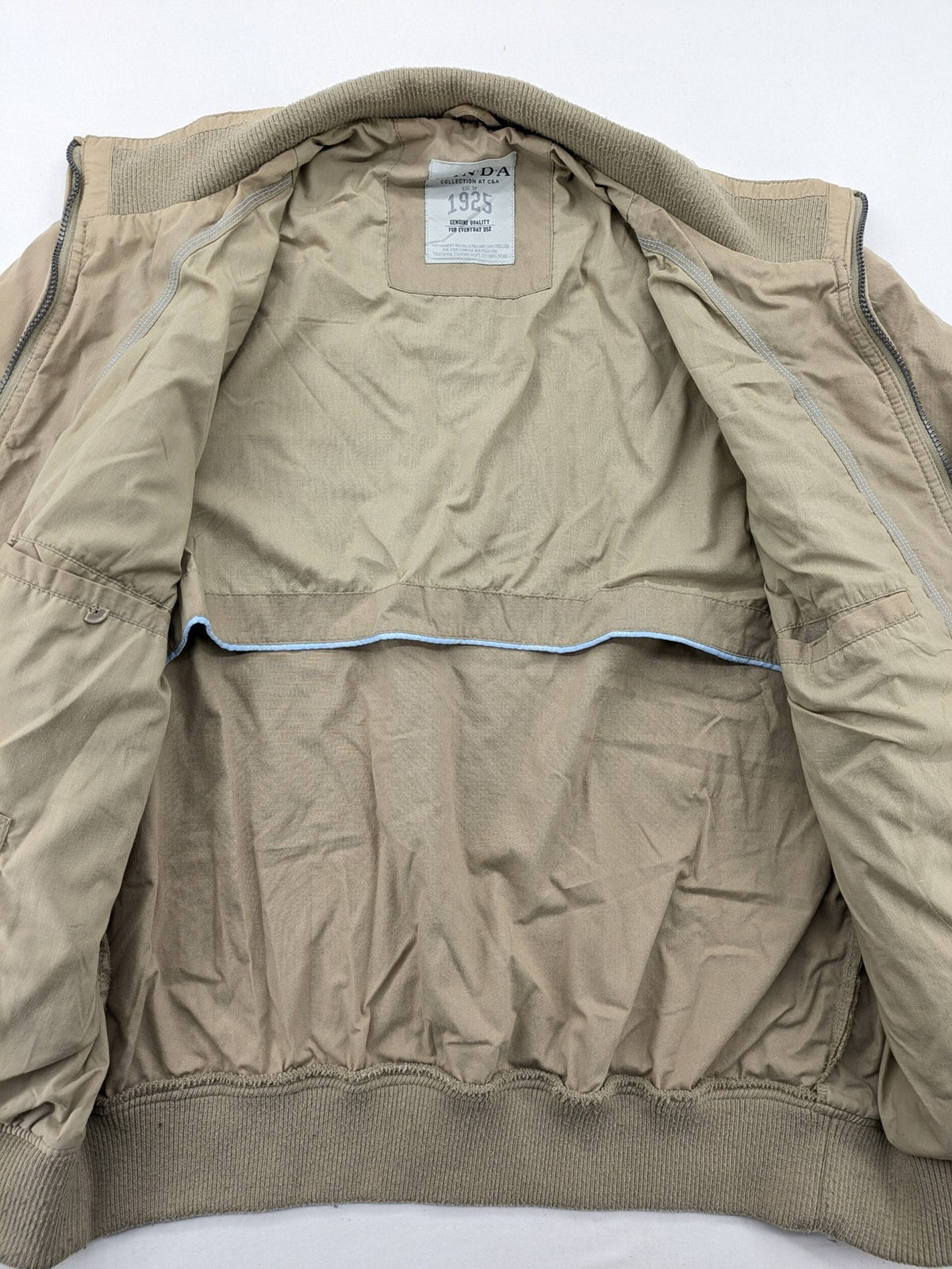 Canda beige bomber jacket full zip with ribbed collar and buttoned chest pockets.