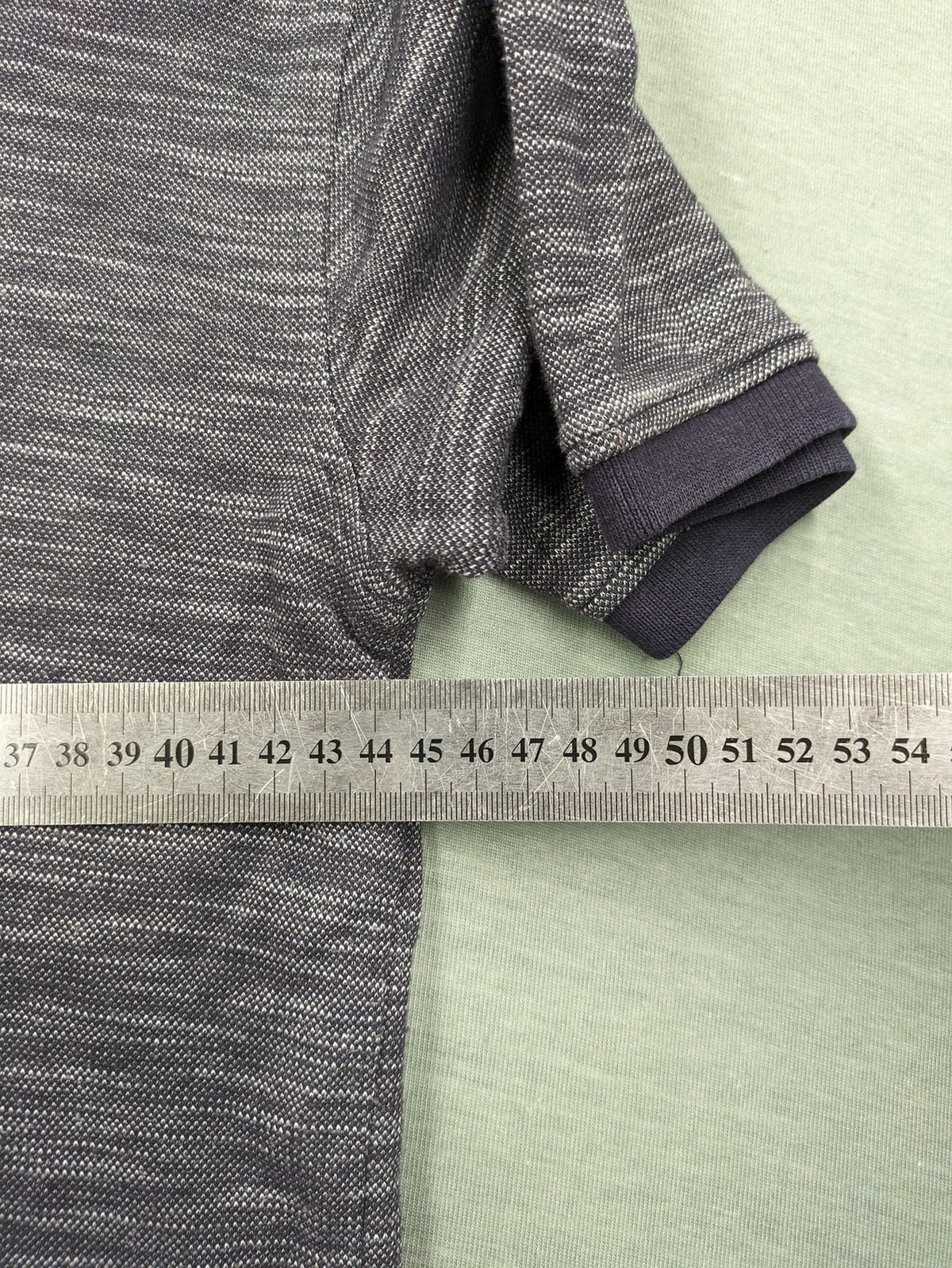 Nautica grey melange polo shirt with contrasting collar and embroidered sail logo.