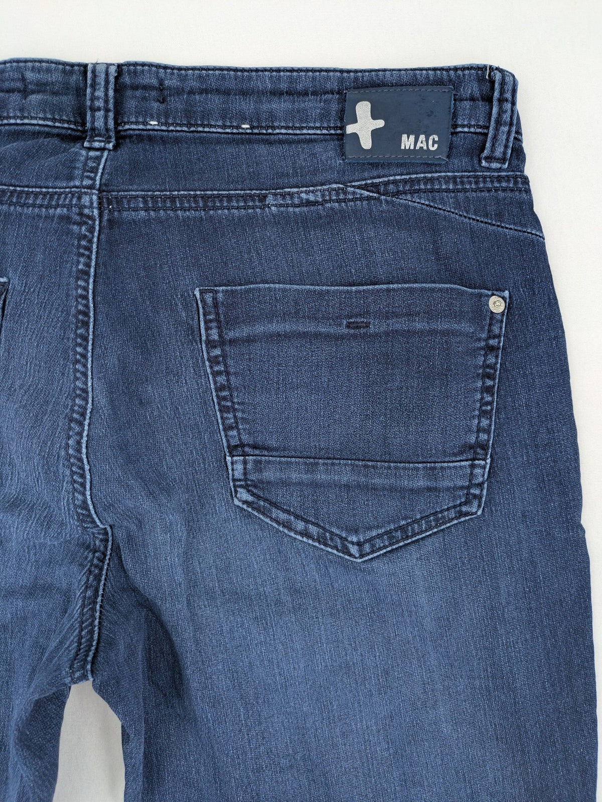 Mac Jeans blue slim fit straight jeans with light wash and stretch material.