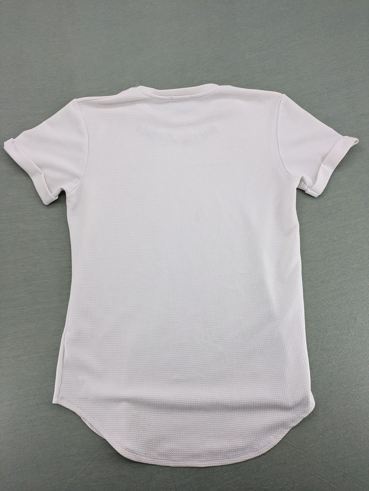MIZ-U white longline t-shirt with "Street Angels" embroidery and rolled sleeves.