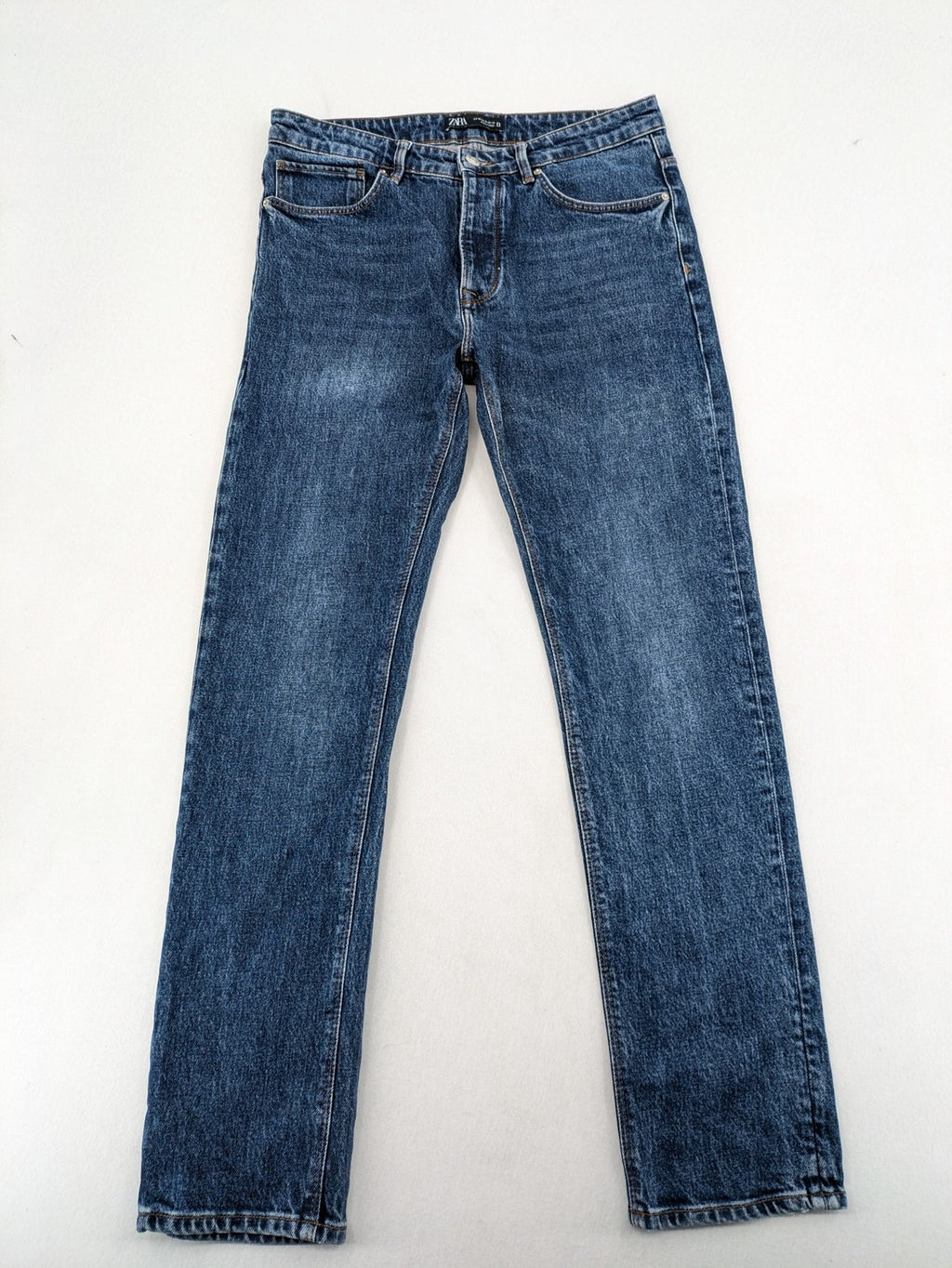 Zara blue straight jeans with classic 5-pocket design and button fly.