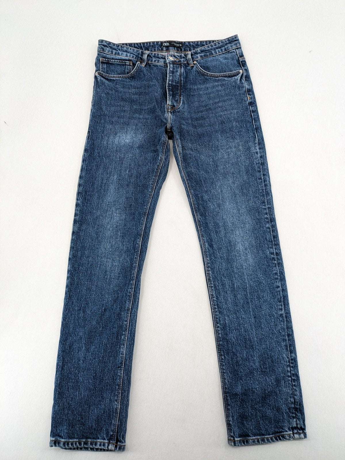 Zara blue straight jeans with classic 5-pocket design and button fly.