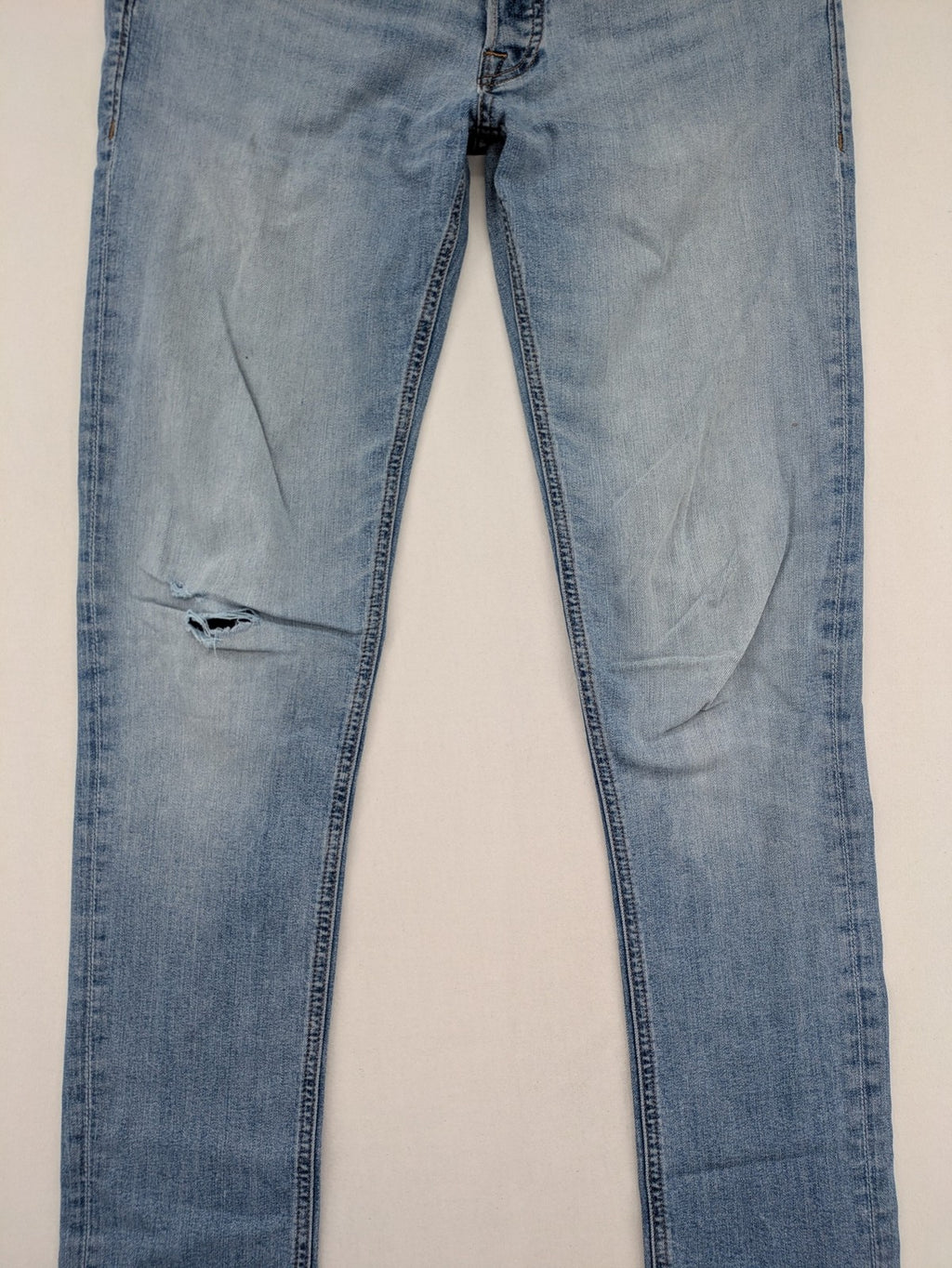 Jack & Jones blue slim jeans with button fly and subtle used look.
