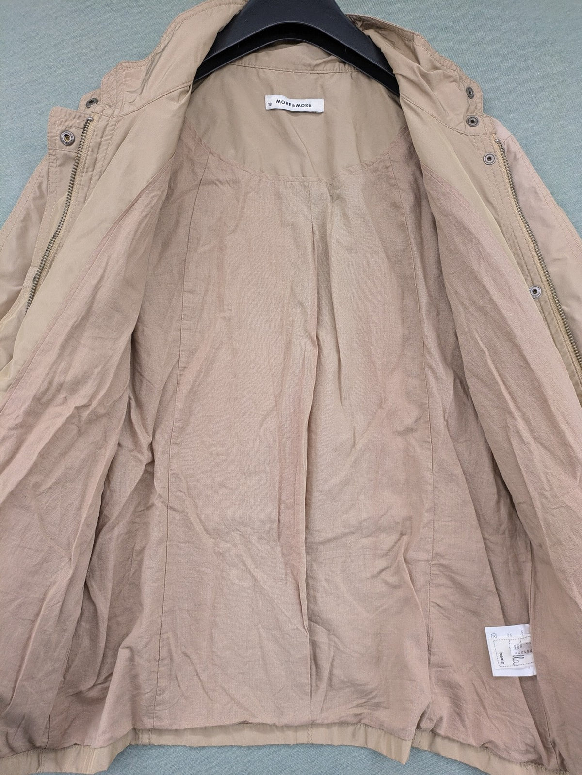 MORE & MORE beige field jacket with belt, four pockets, and standing collar.