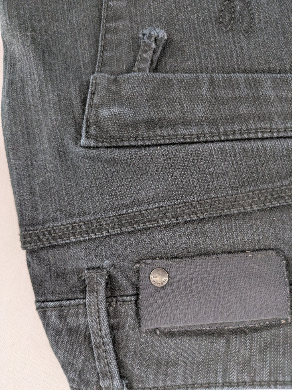 Yessica black straight jeans with classic dark wash and stretch denim material.