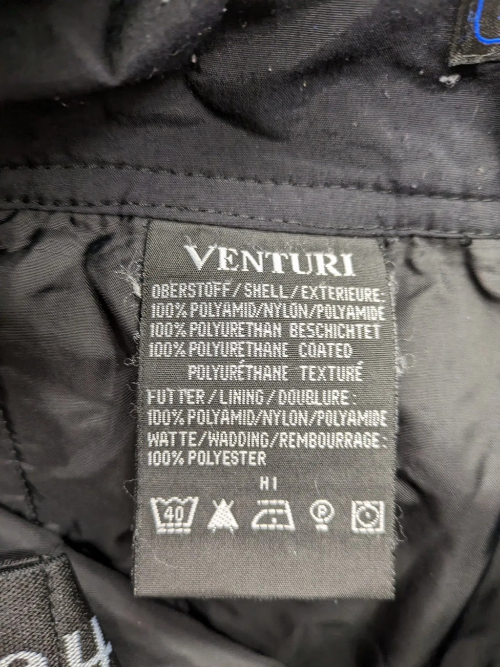 Schoffel black ski pants with adjustable straps, zip pockets, and snow gaiters.