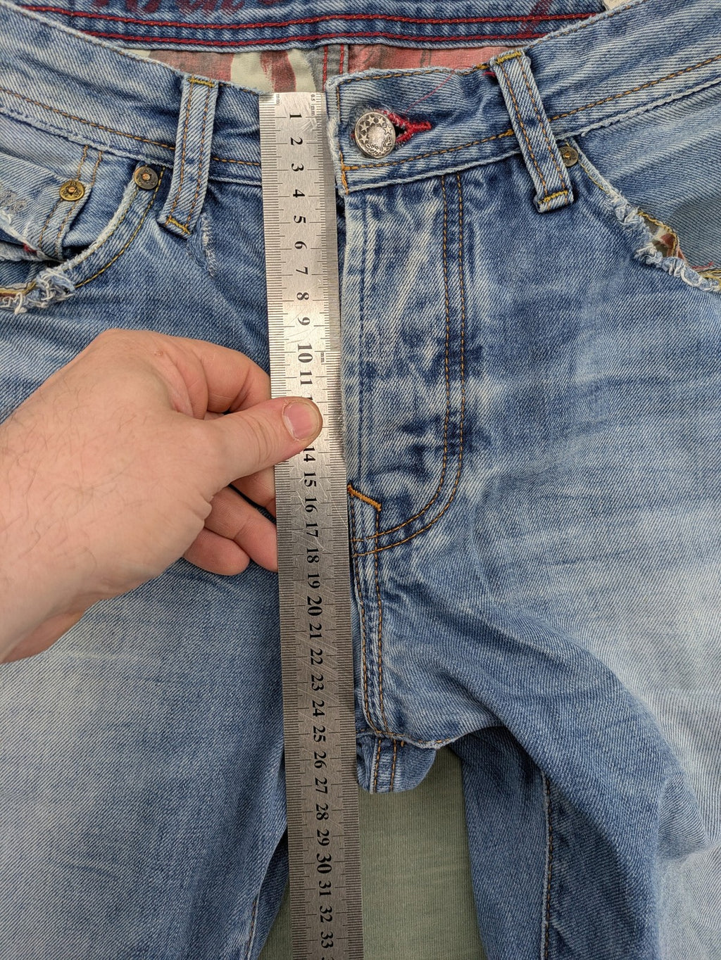 Pepe Jeans blue straight jeans with Union Jack embroidery and distressed denim finish.