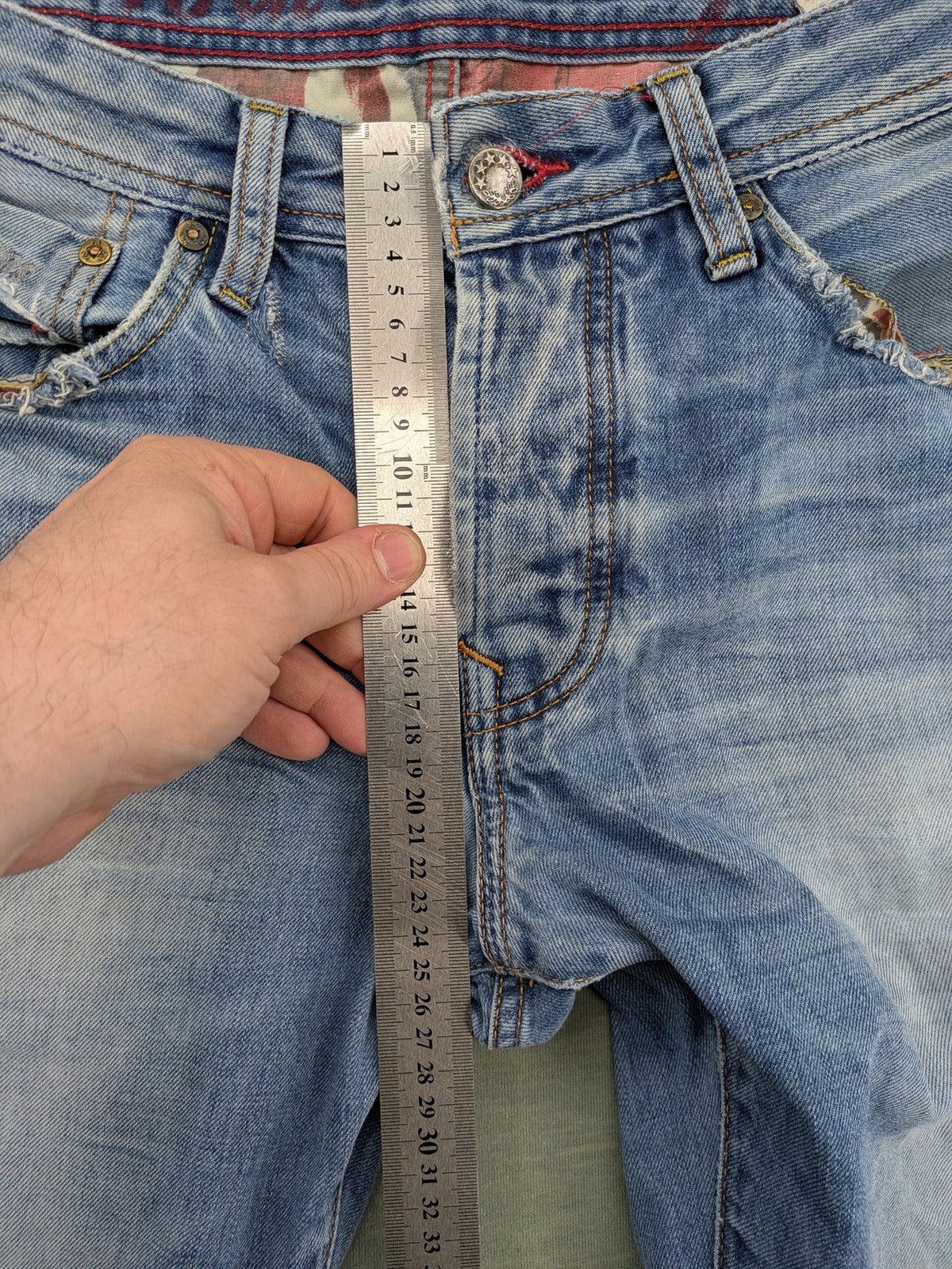 Pepe Jeans blue straight jeans with Union Jack embroidery and distressed denim finish.