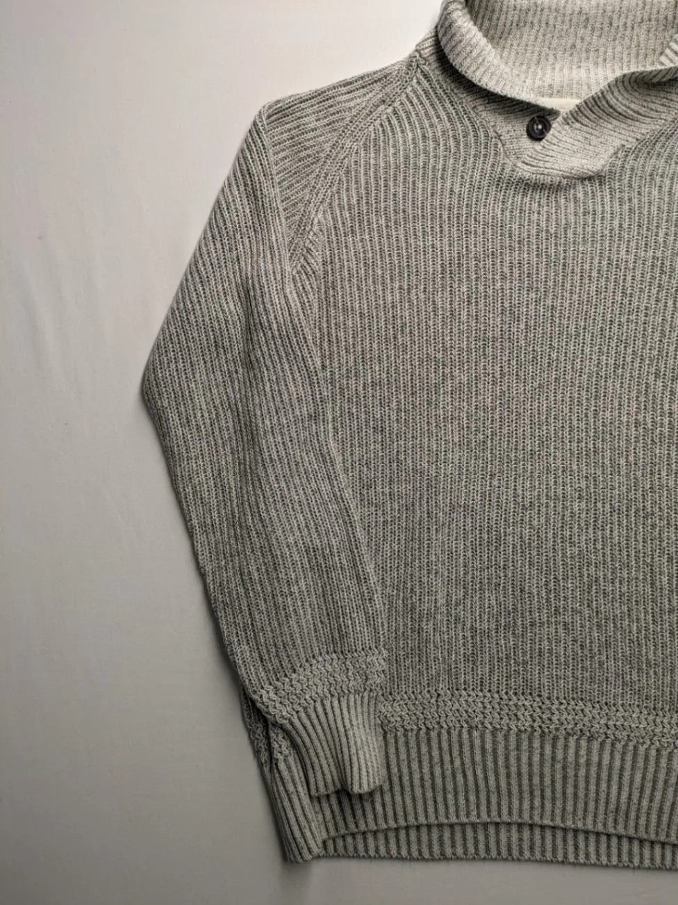 Autumn Glow grey turtle neck jumper with ribbed pattern and button detail.