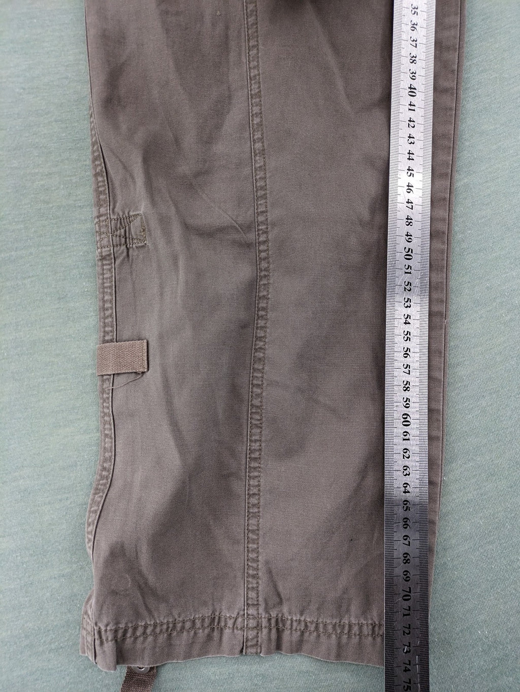 Columbia grey cargo pants with multiple pockets and drawstring waist, 100% cotton.