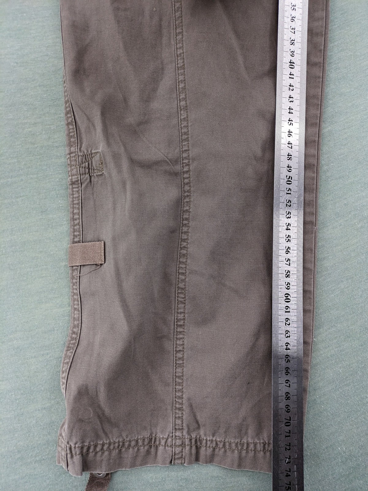 Columbia grey cargo pants with multiple pockets and drawstring waist, 100% cotton.