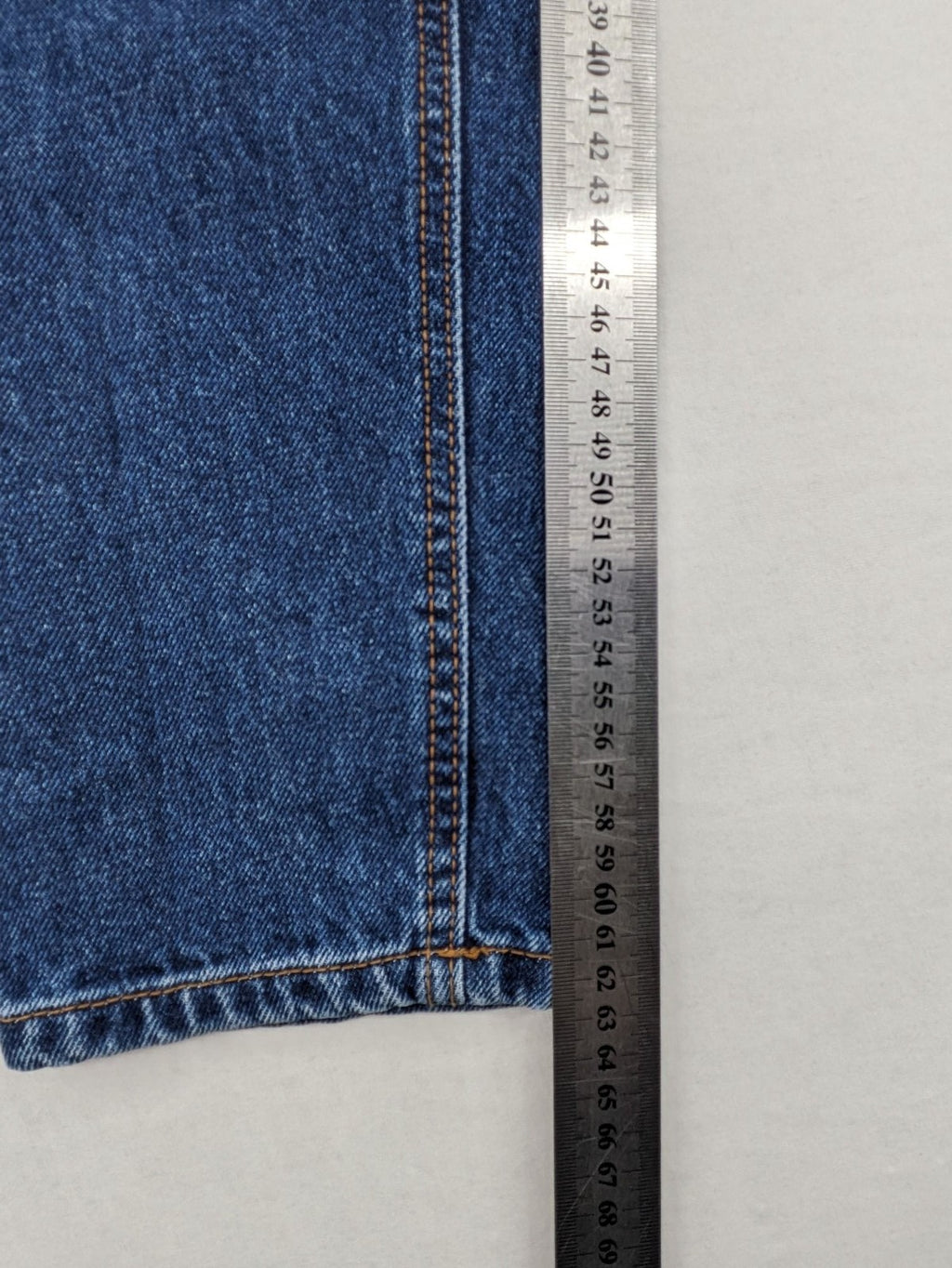 Stradivarius blue mom jeans high waist with button fly and classic denim texture.