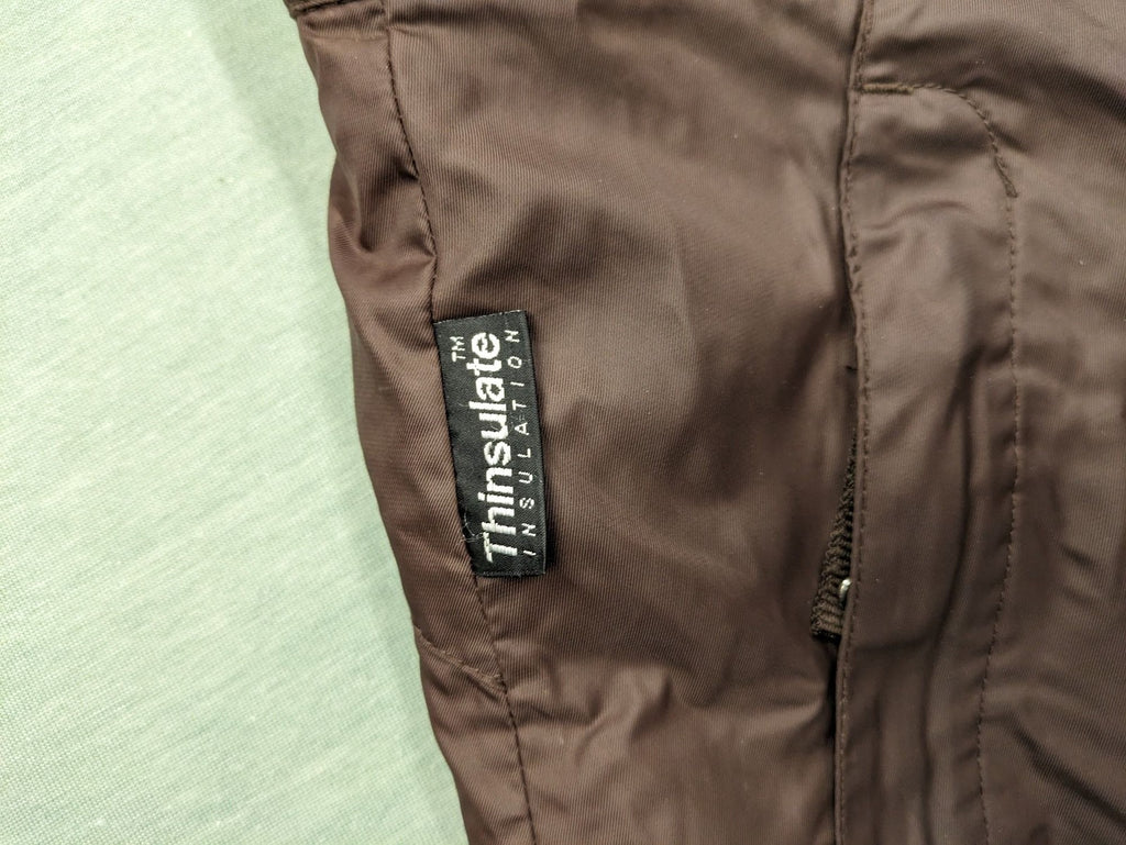 Thinsulate black and blue ski jumpsuit with hood and zippered pockets.