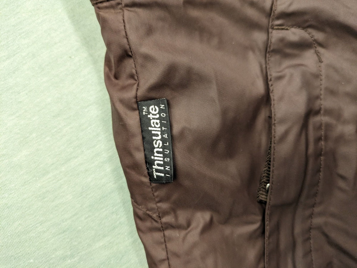 Thinsulate black and blue ski jumpsuit with hood and zippered pockets.