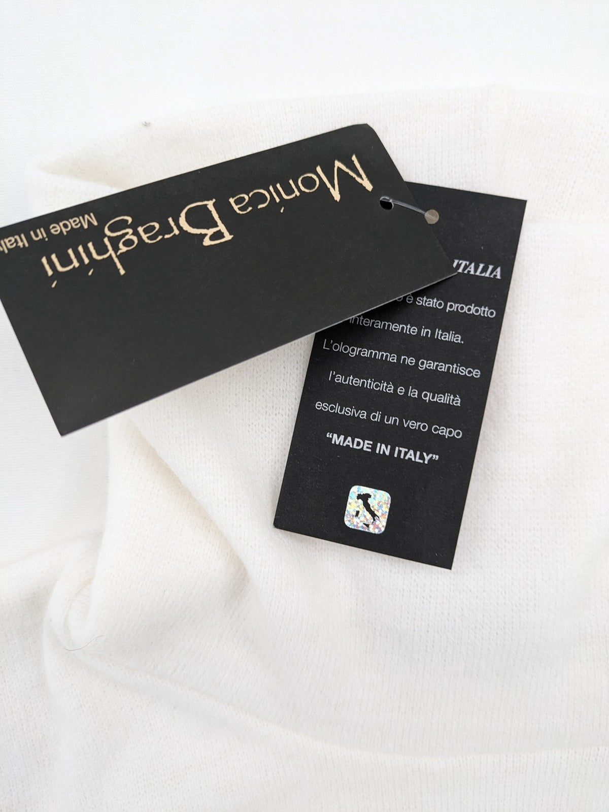 Monica Braghini white turtle neck jumper soft fabric classic design with high collar.