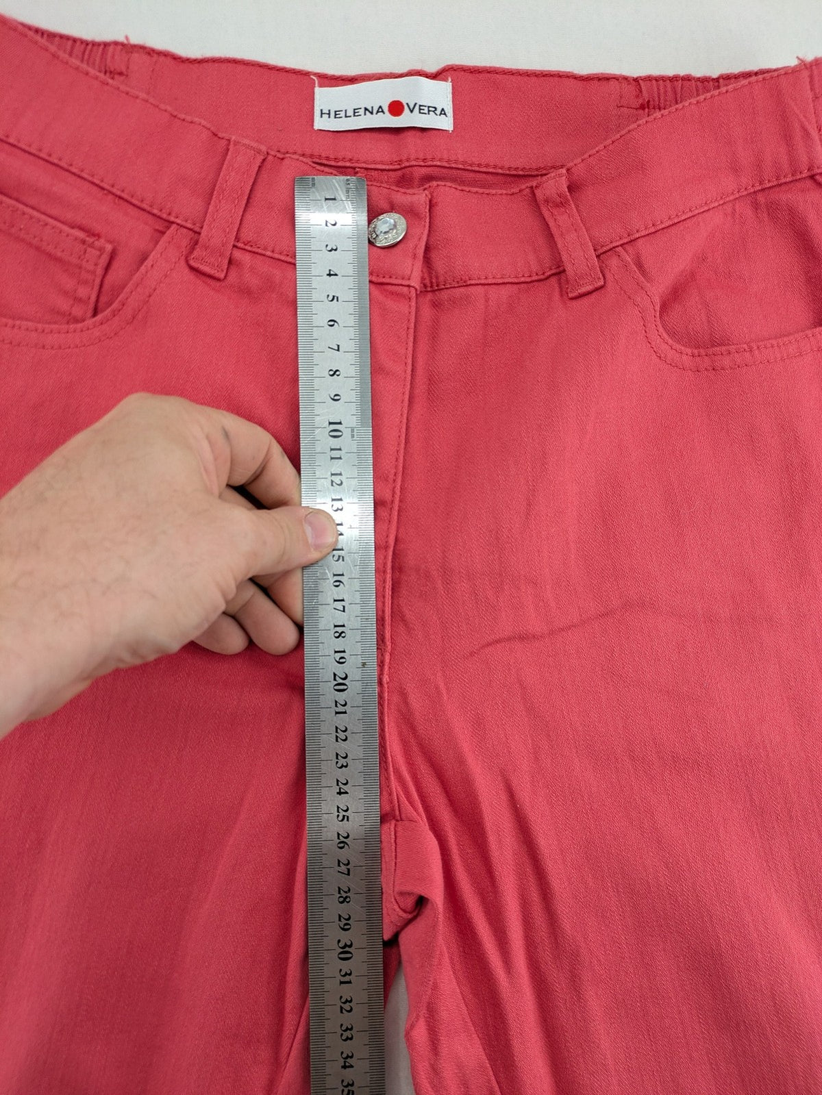 Helena Vera red straight jeans with elastic waistband and rhinestone details on pockets.