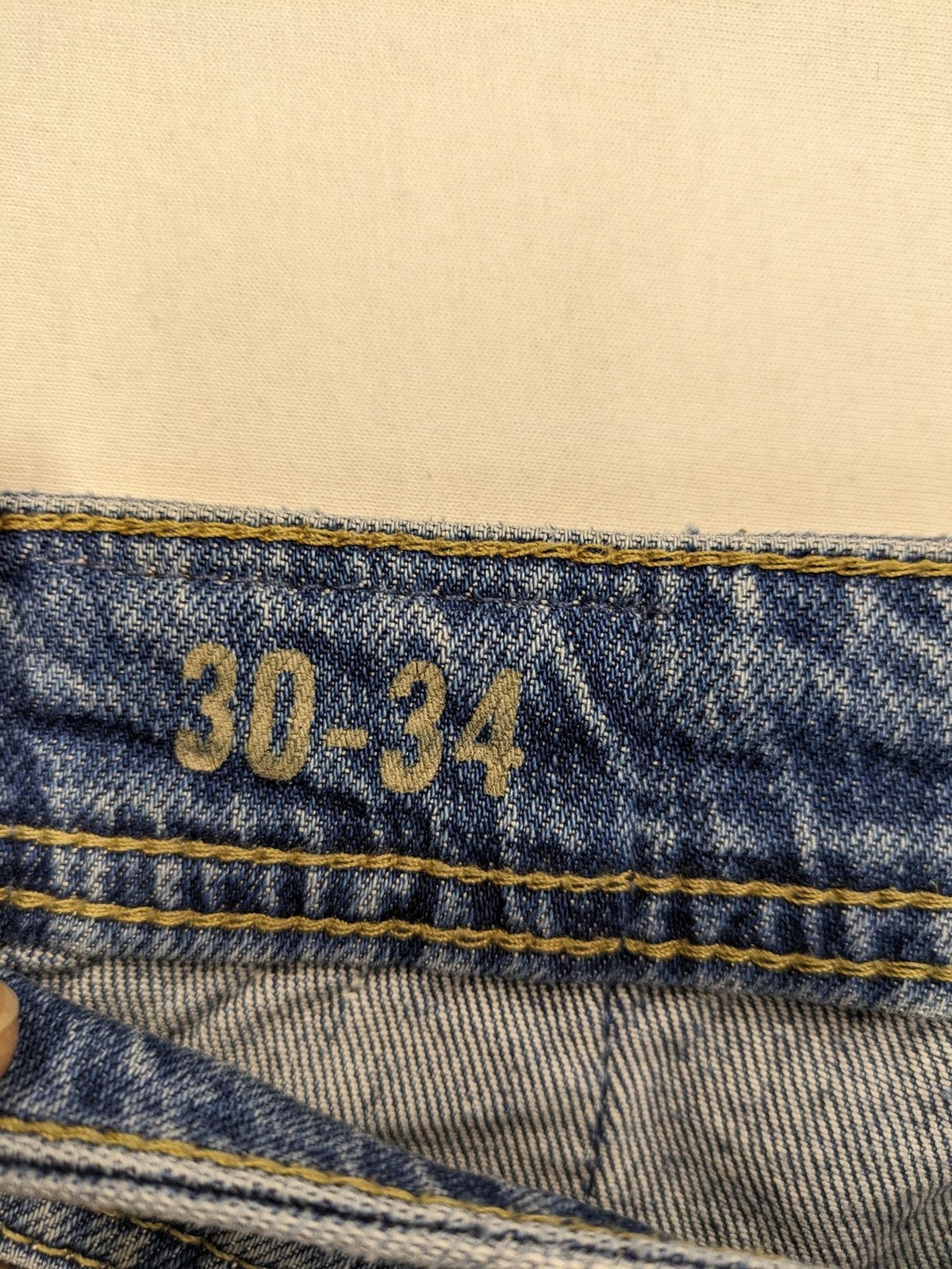 CHASIN' blue slim fit jeans with button fly and classic denim craftsmanship.