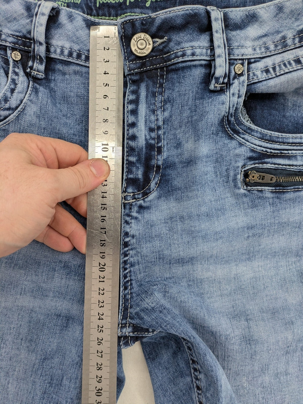 Multiblu blue straight jeans slim fit with decorative front zippers and light wash.
