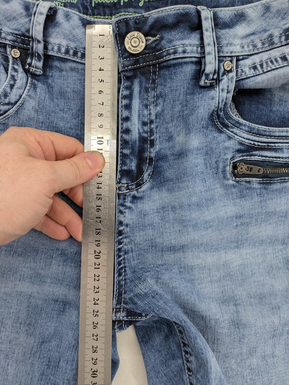 Multiblu blue straight jeans slim fit with decorative front zippers and light wash.
