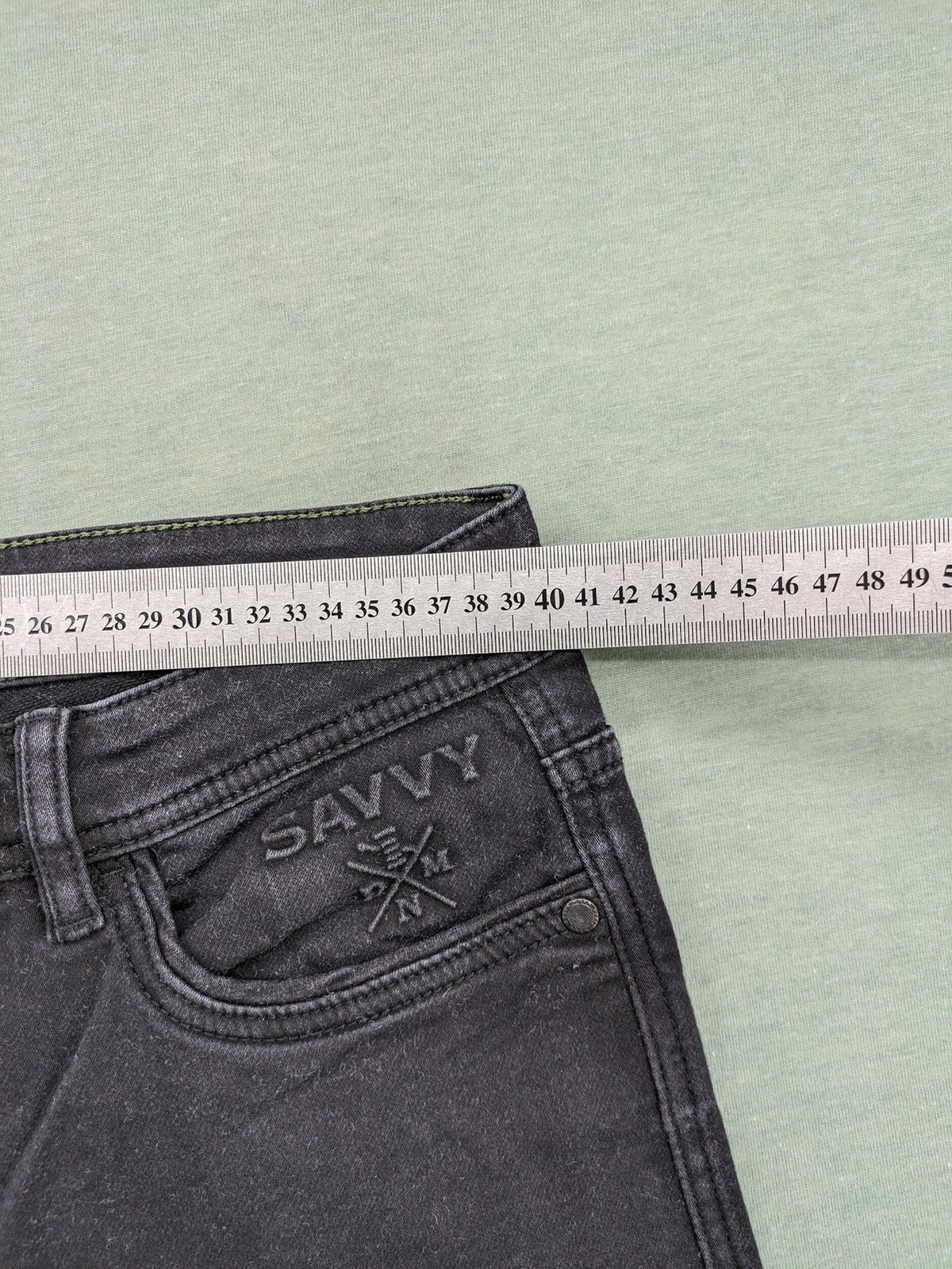 Savvy black straight jeans with washed finish and slim fit, made from stretch denim.