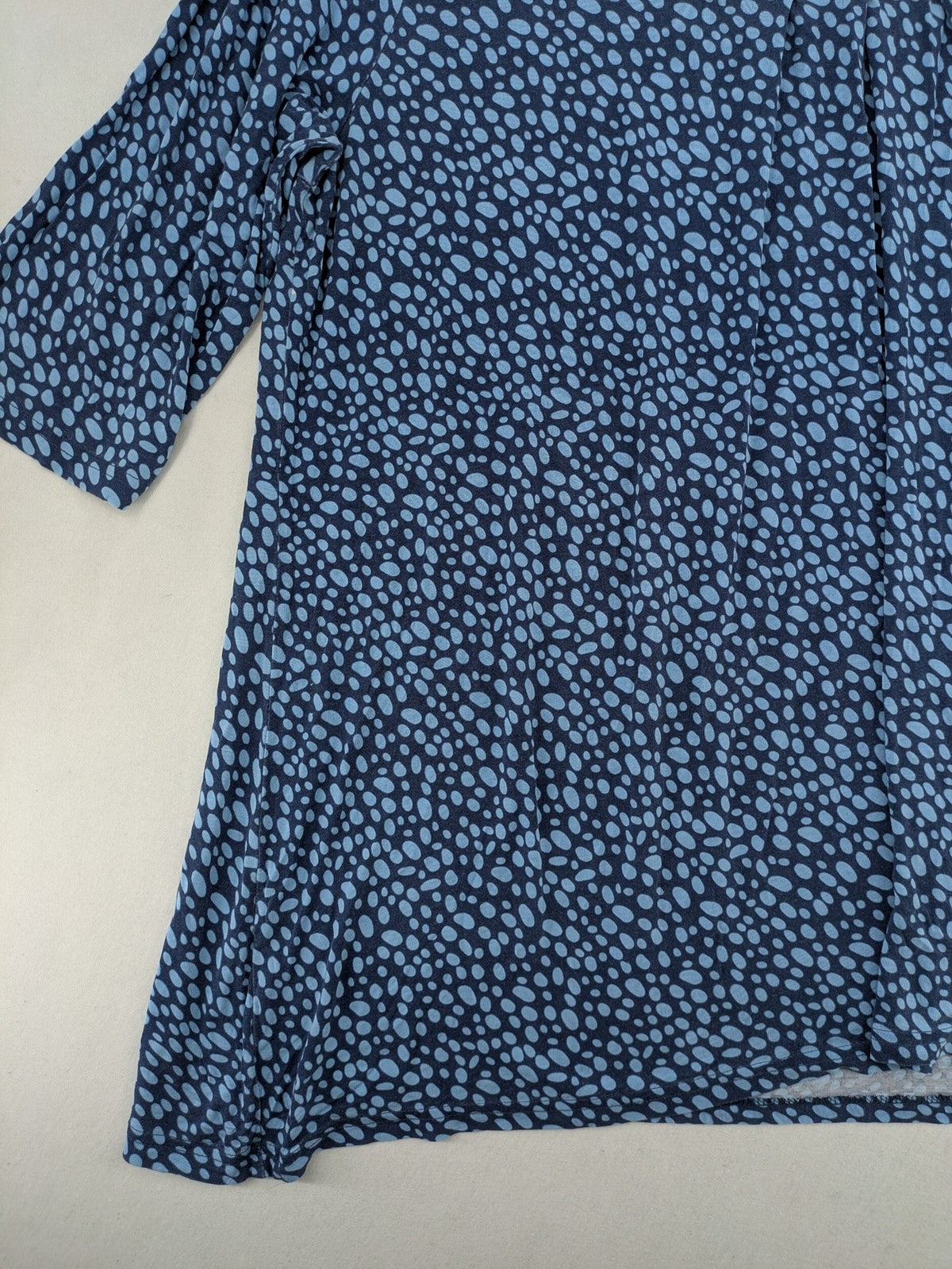 Ulla Popken blue tunic top with light blue polka dots and A-line cut.