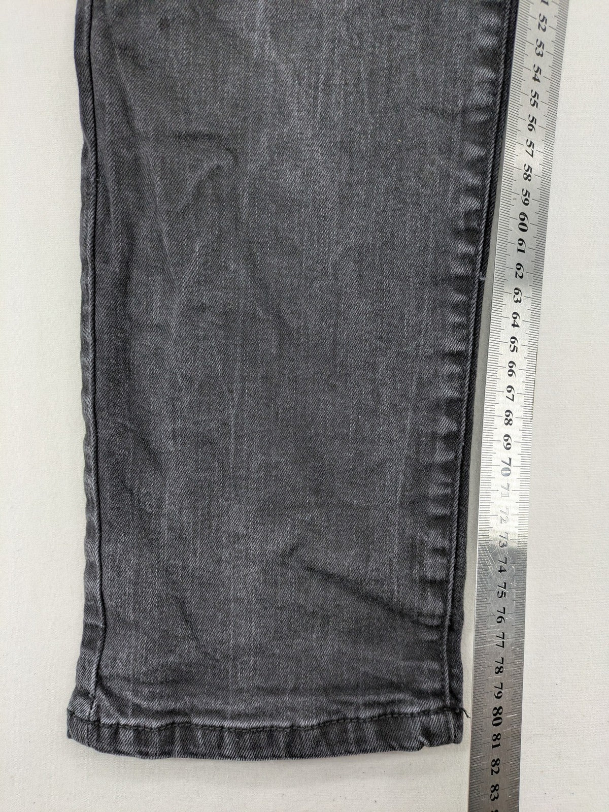 Denim 1982 grey slim fit jeans with ripped knee detail and distressed finish.