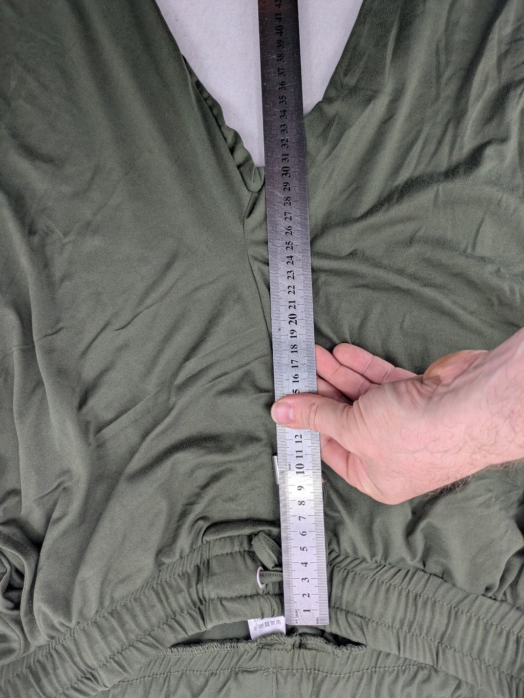 Infinity green jogger pants with elastic waistband and side pockets, soft stretch material.