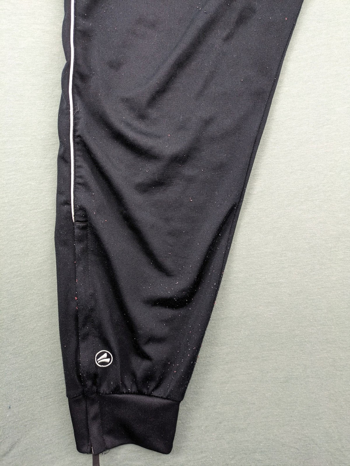 Jako black training pants size L with zippered pockets and elastic waistband.
