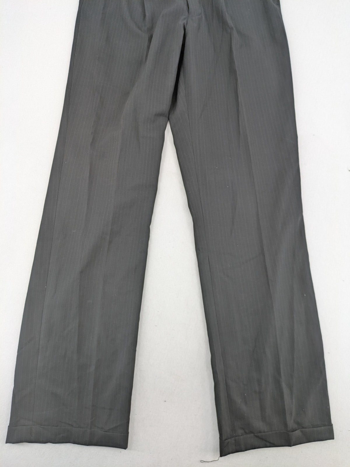 Wahl grey dress pants with pinstripe pattern and pleats, featuring side and back pockets.