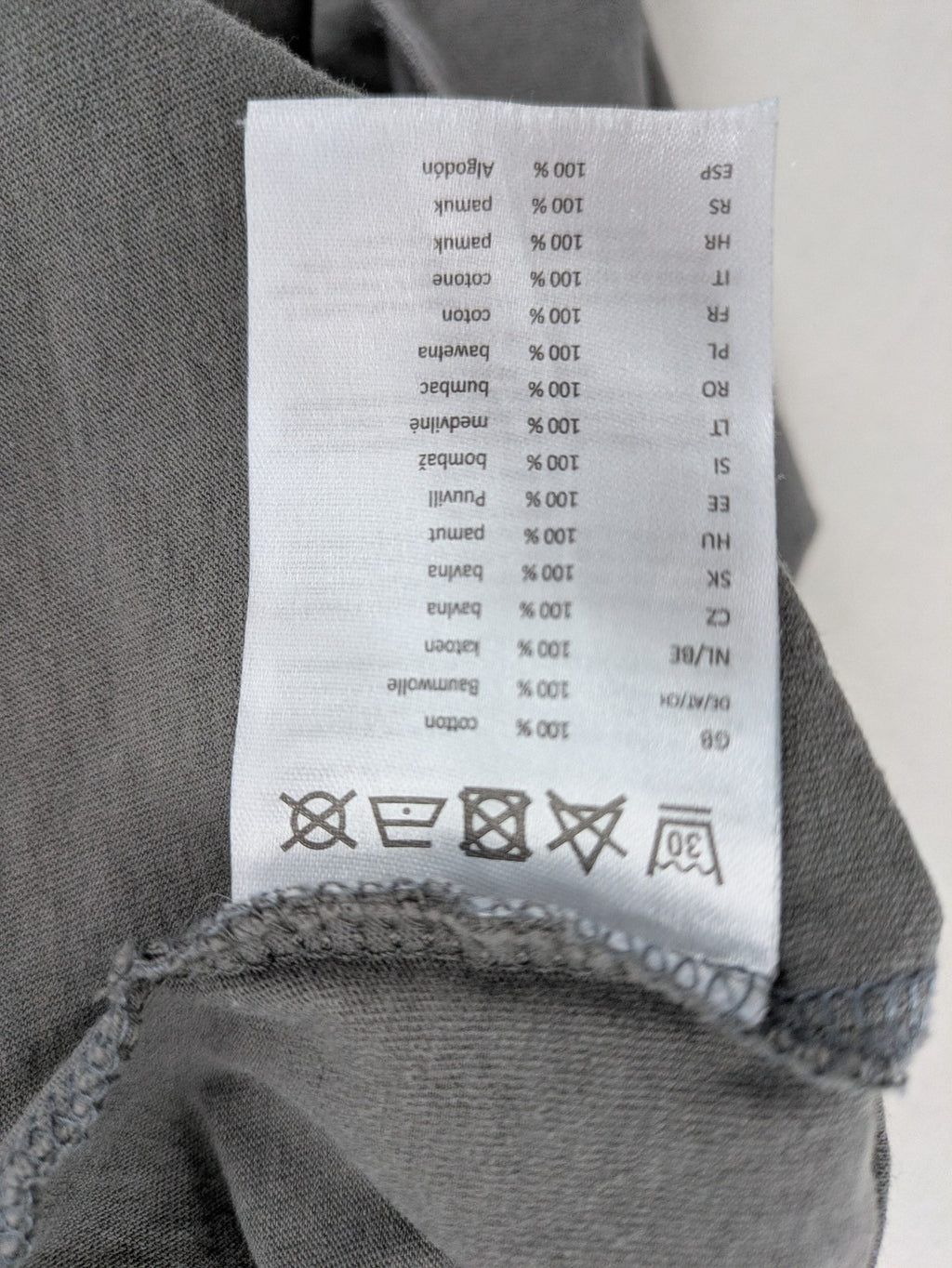Nirvana grey t-shirt with rainbow Smiley logo and "Come As You Are" text.