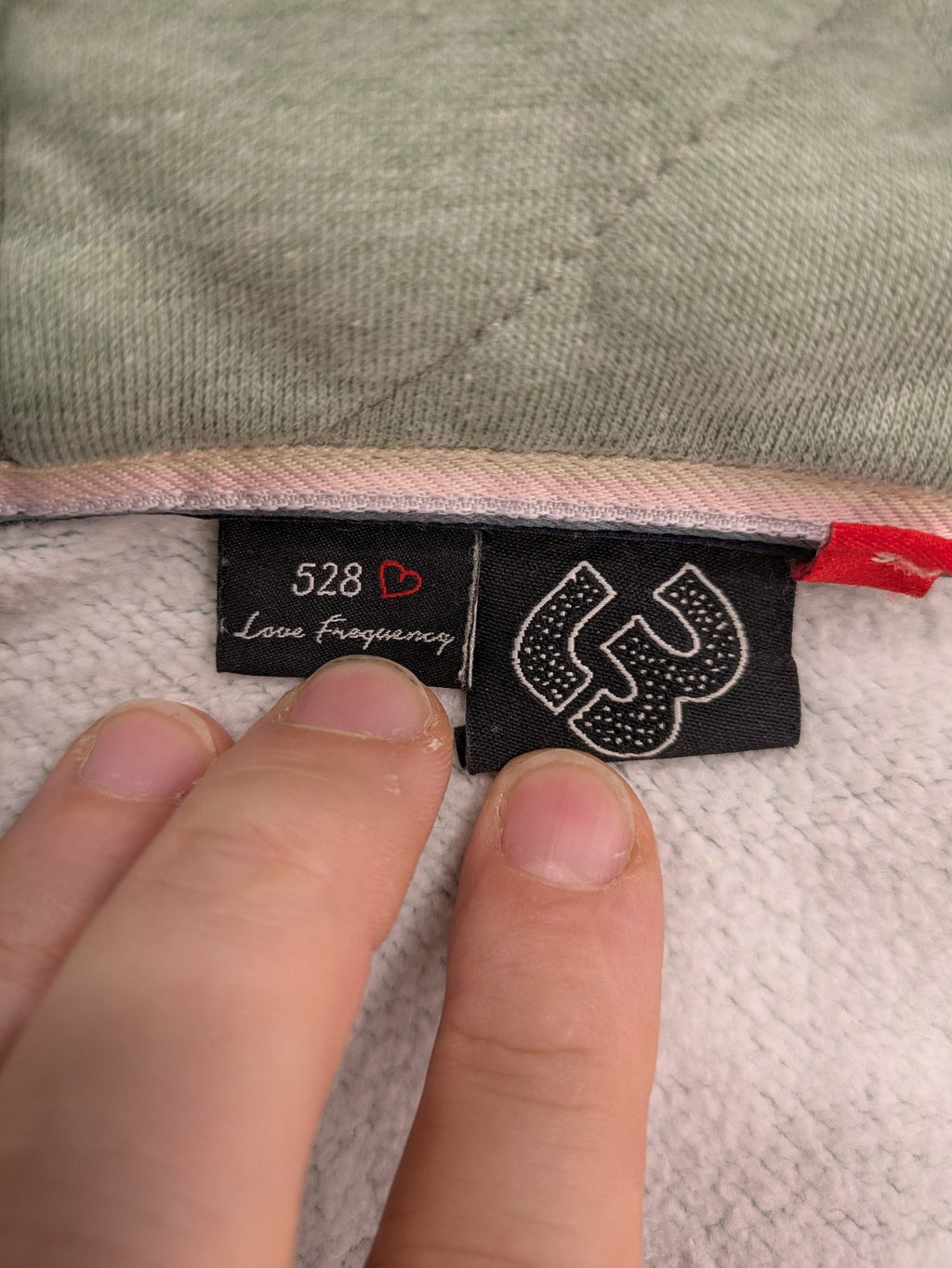 Ragwear grey hoodie jacket with high collar, thick drawstrings, and vegan materials.