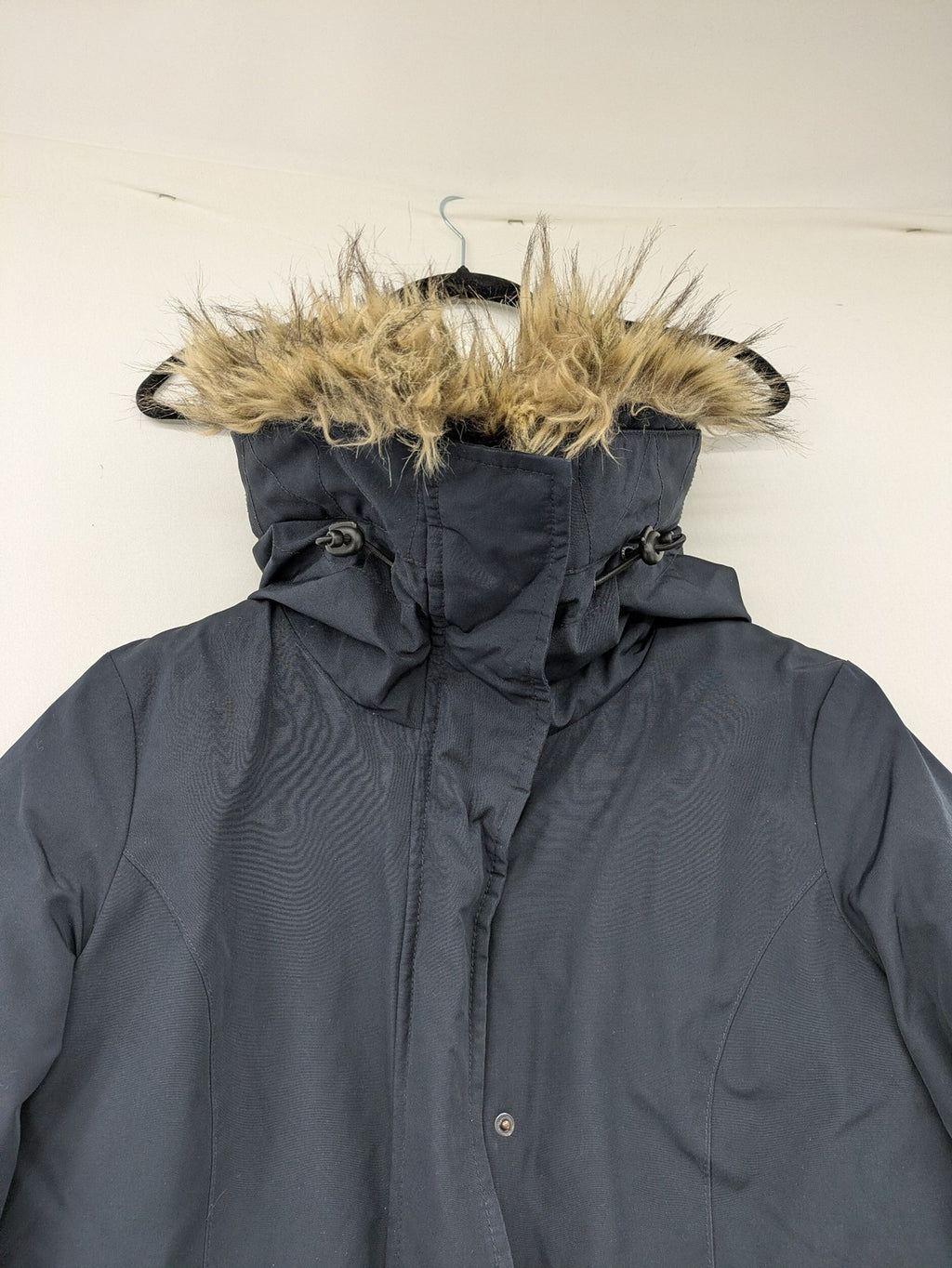 Reset Fifty Seven cream puffer coat with faux fur hood and down insulation.