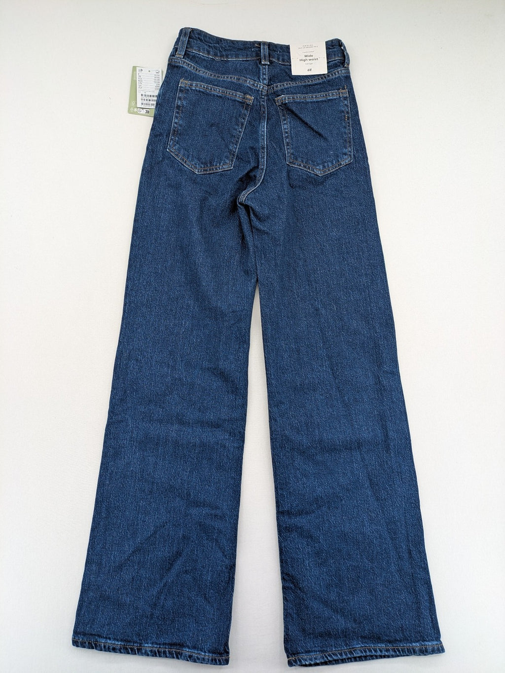 H&M blue wide leg high waist jeans with classic 5-pocket design and stretch denim.