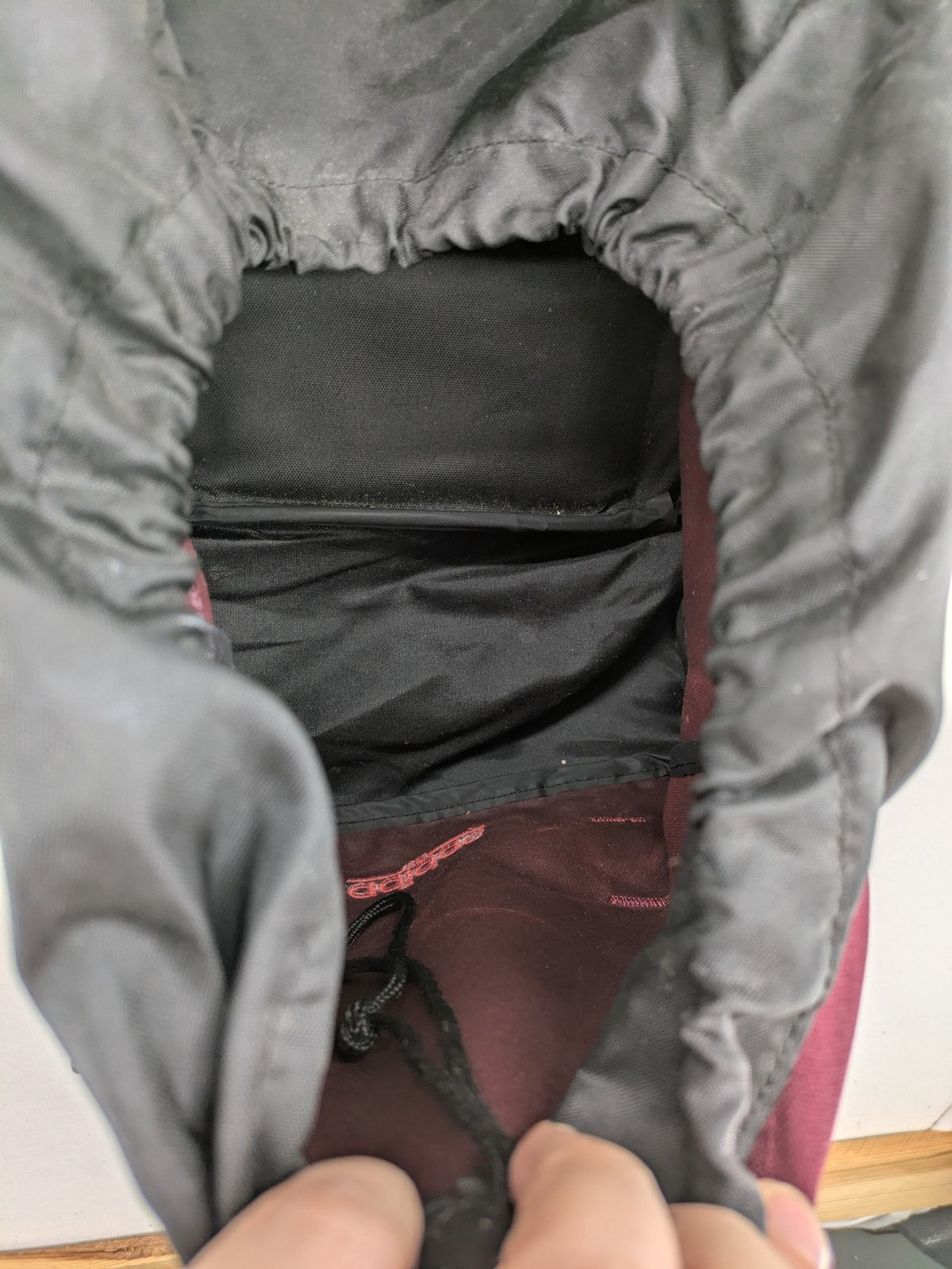 Adidas burgundy vintage rucksack with logo, Teflon fabric, and drawstring closure.
