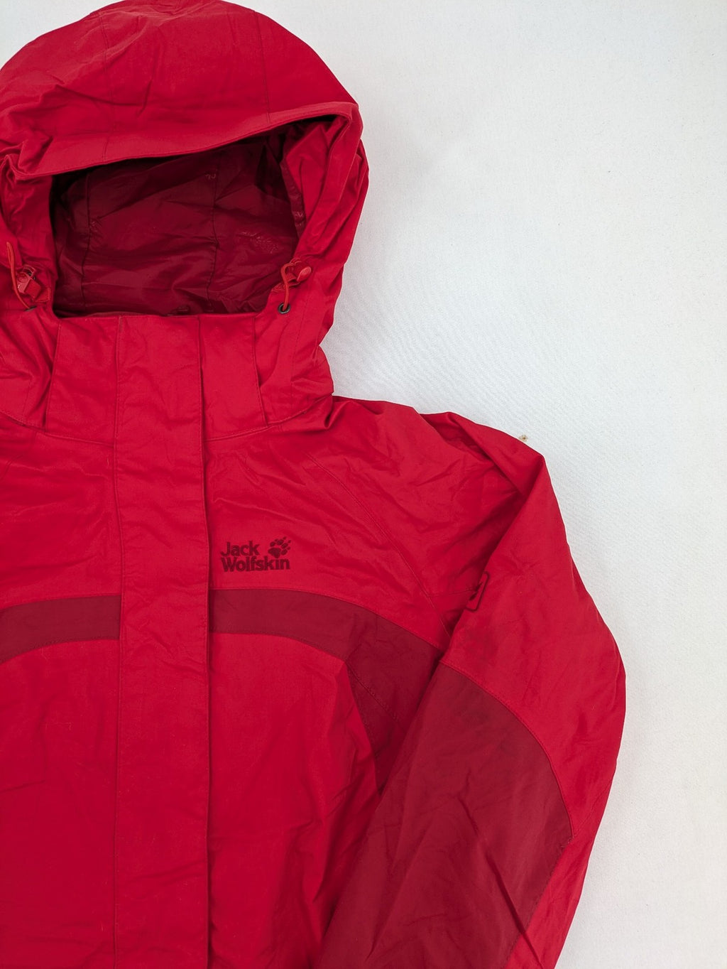 Jack Wolfskin red outdoor jacket with adjustable hood and Texapore waterproof technology