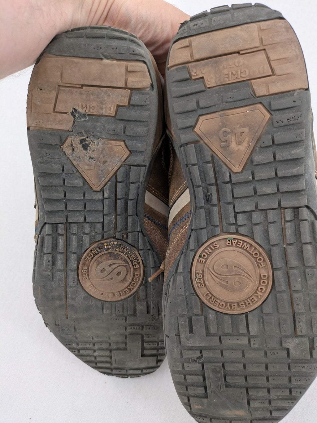 Dockers brown sneakers with subtle light brown and blue accents, lace-up design.