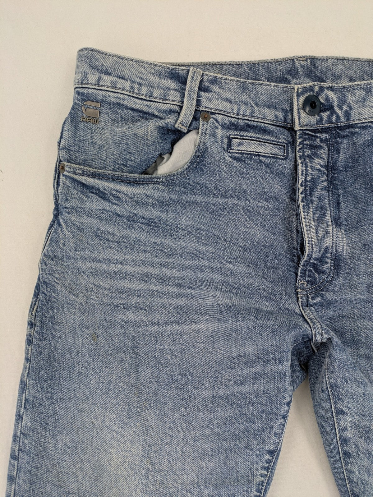 G-Star Raw blue slim fit jeans with 5-pocket design and light wash denim.