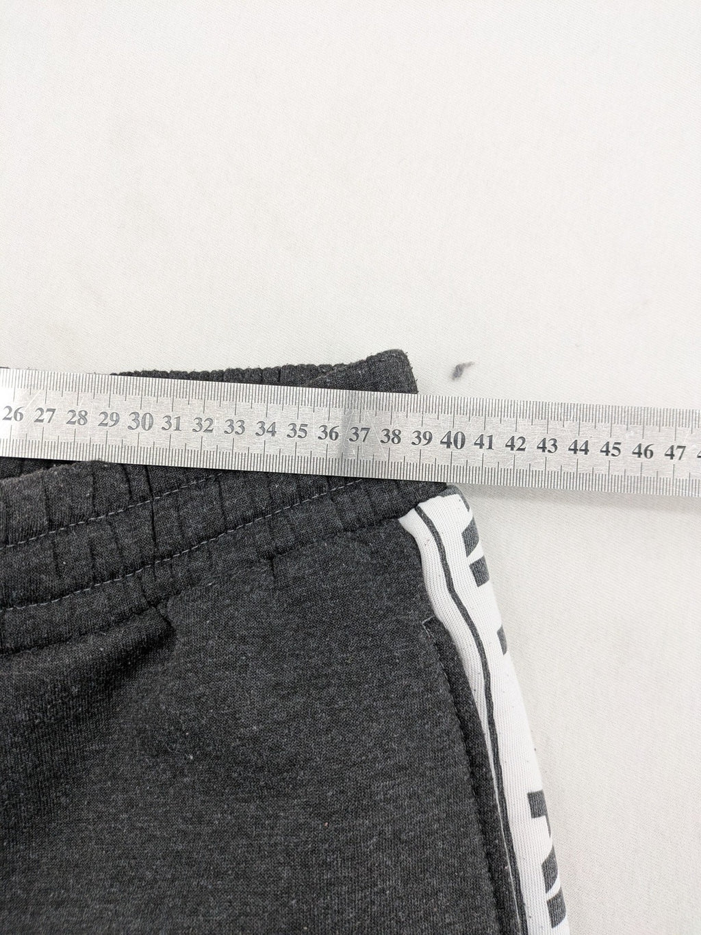 Amstaff grey sweatpants with large dog logo and "Trust & Loyalty" text.