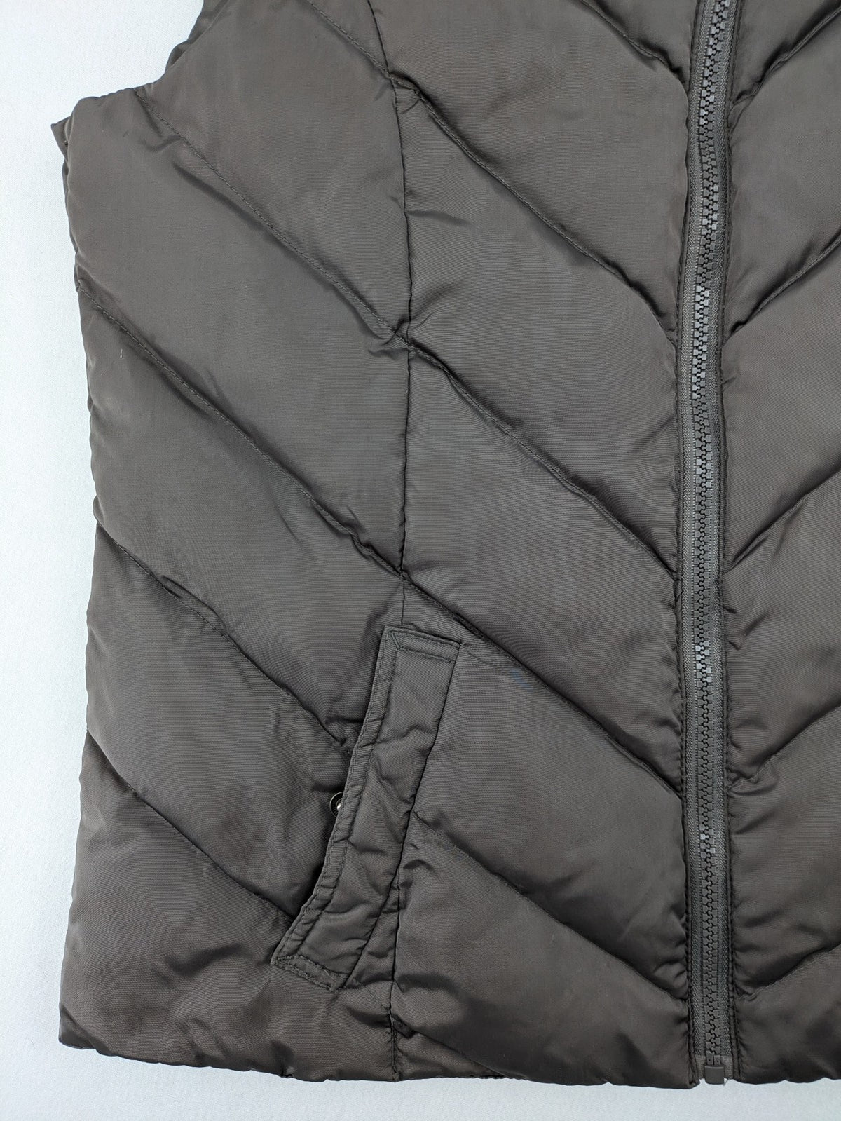 L&A Fashion grey puffer vest with zip closure, stand collar, and side pockets.