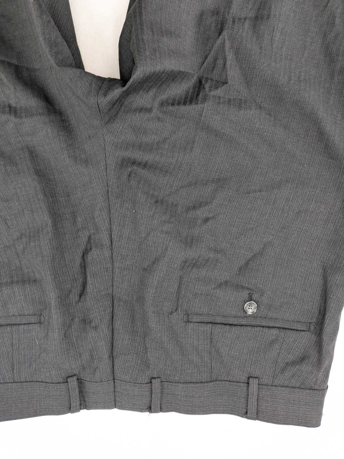 Desch grey suit pants with subtle pinstripe pattern and flat front design.