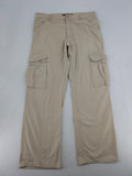 Cottonfield beige cargo pants with multiple pockets and button flaps.