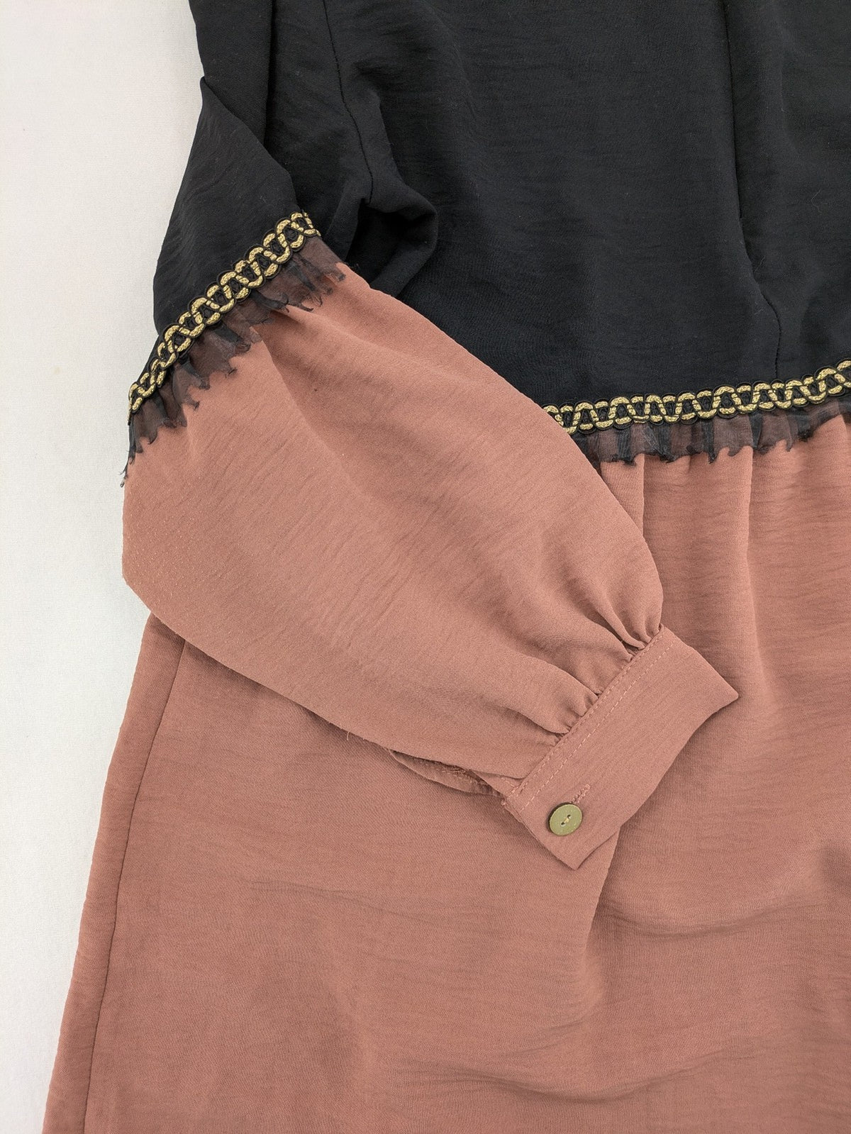 Efsun Moda grey and pink A-line dress with gold decorative chains and long balloon sleeves.