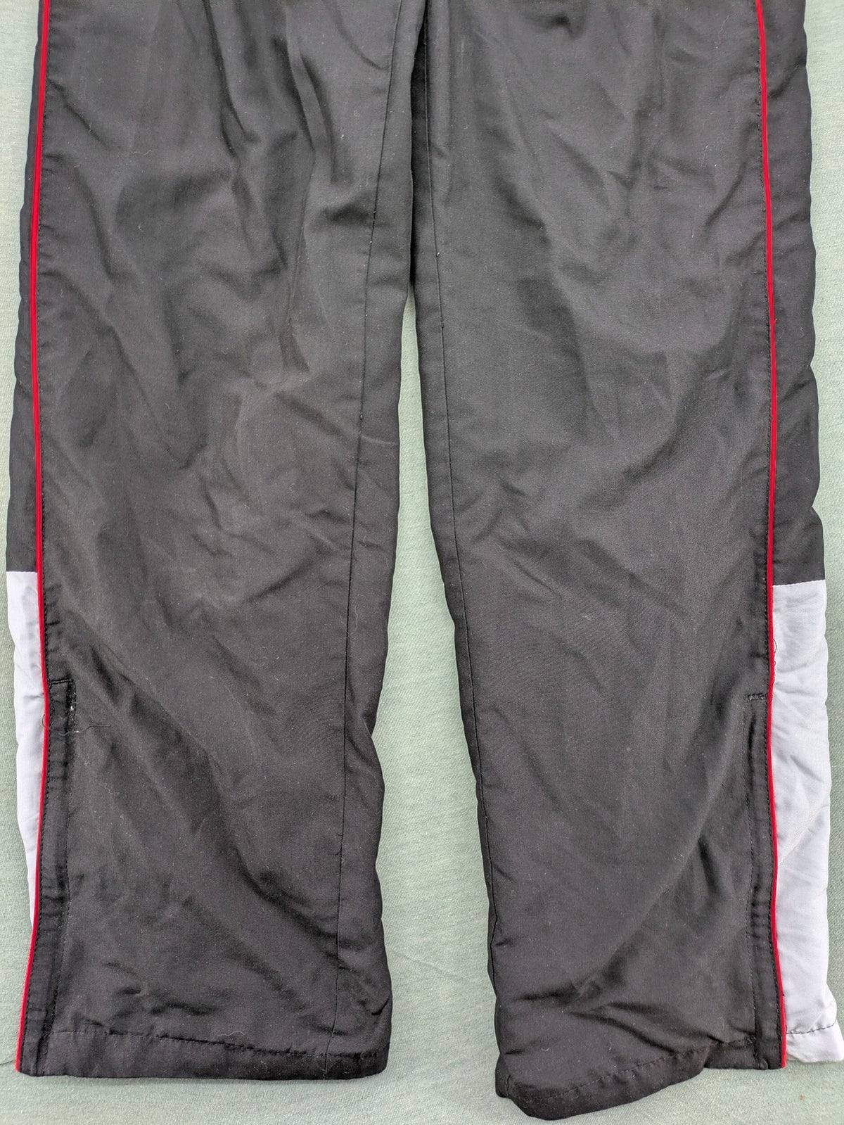 Fila grey jogging pants with red piping and embroidered logo on thigh.