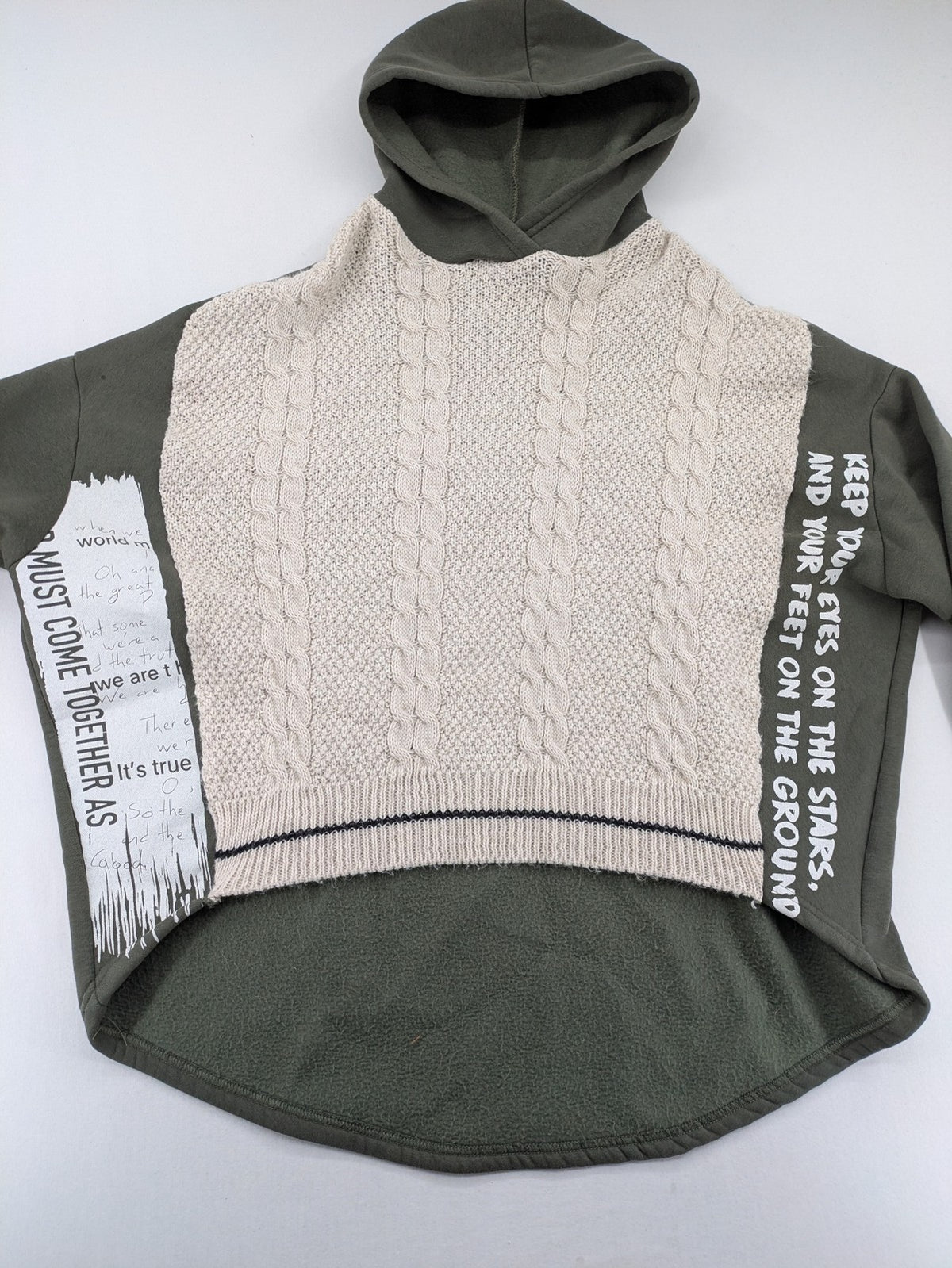 DCJ cream and olive green hoodie with cable knit pattern and graphic text sleeves.
