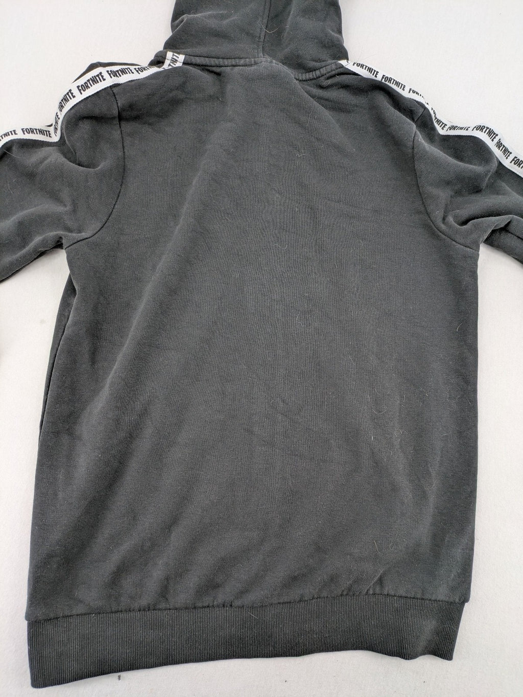 Fortnite black zip-through hoodie with logo on sleeves and Black Knight patch on chest.